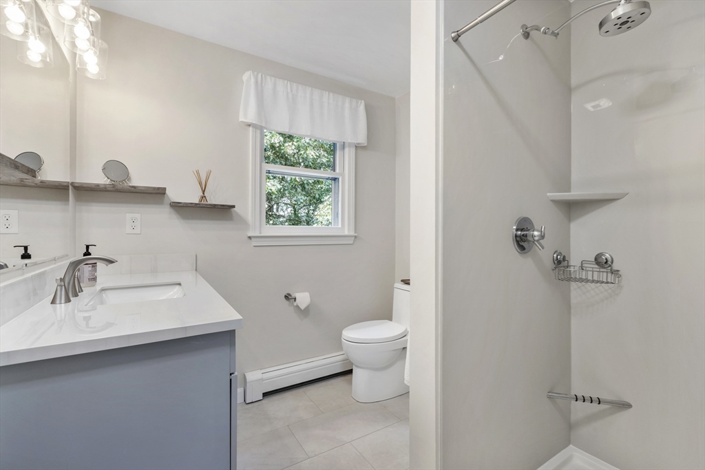 61 Sunset Drive Milford, MA 01757 - Photo 22 of 42 a bathroom with a sink toilet and a mirror