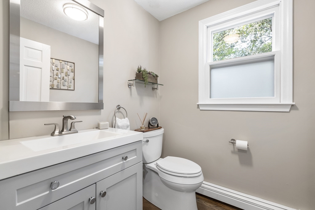 61 Sunset Drive Milford, MA 01757 - Photo 30 of 42 a bathroom with a toilet sink and mirror