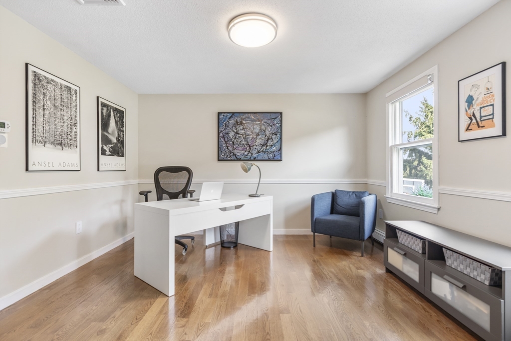 61 Sunset Drive Milford, MA 01757 - Photo 31 of 42 a view of a workspace with furniture window and wooden floor