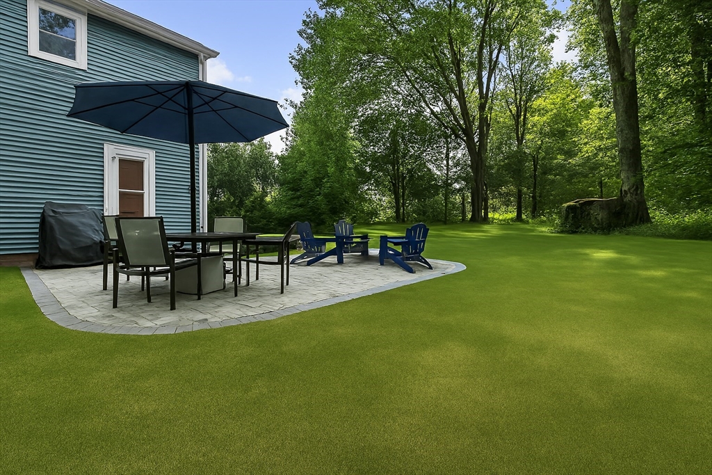 61 Sunset Drive Milford, MA 01757 - Photo 35 of 42 a view of a backyard with sitting area
