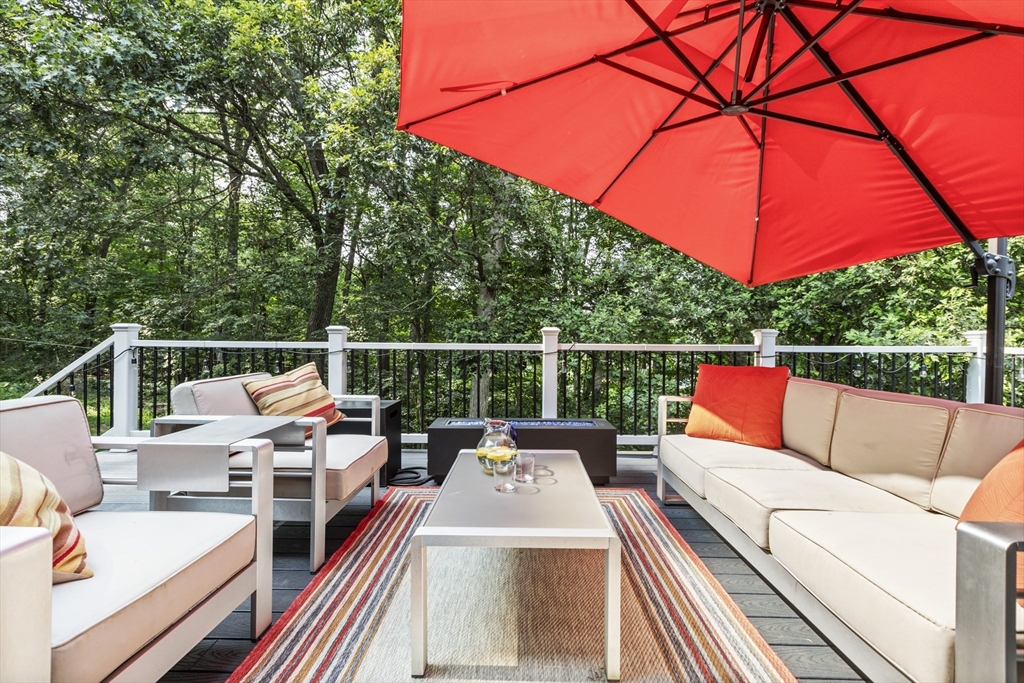 61 Sunset Drive Milford, MA 01757 - Photo 38 of 42 a view of a deck with a patio