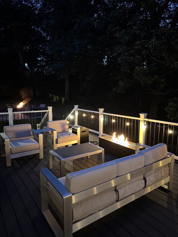 61 Sunset Drive Milford, MA 01757 - Photo 40 of 42 a view of a terrace with seating area