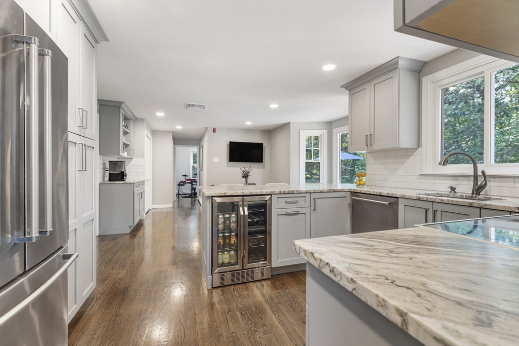 61 Sunset Drive Milford, MA 01757 - Photo 4 of 42 a kitchen with stainless steel appliances kitchen island granite countertop a stove and a sink
