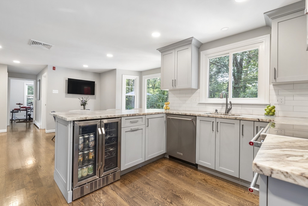 61 Sunset Drive Milford, MA 01757 - Photo 9 of 42 a kitchen with a sink appliances cabinets and a counter top space