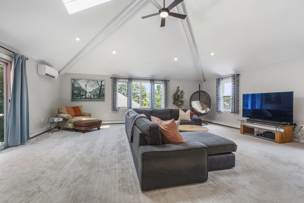 61 Sunset Drive Milford, MA 01757 - Photo 10 of 42 a living room with furniture and a flat screen tv