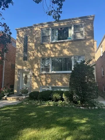 a view of house with yard