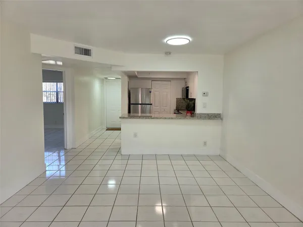 a view of a livingroom with an empty space and a sink