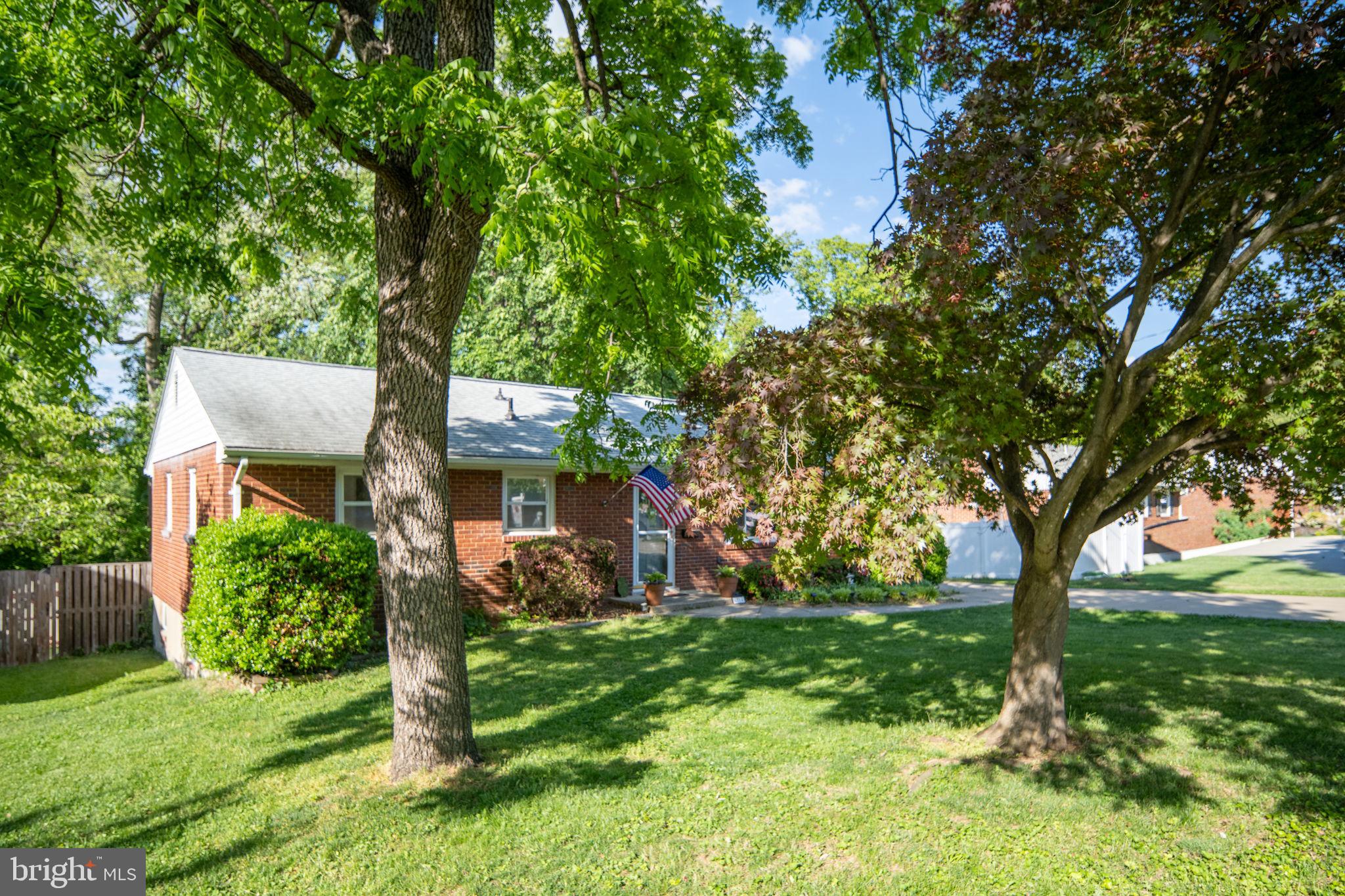 6714 Ruskin Street Springfield, VA 22150 - Photo 3 of 63 a view of a house with a tree in a yard