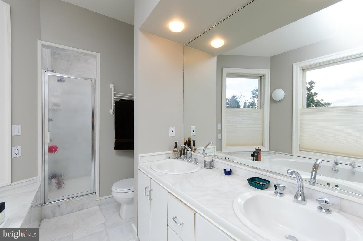214 11th Street Northeast Washington, DC 20002 - Photo 19 of 30 a bathroom with a sink toilet and shower