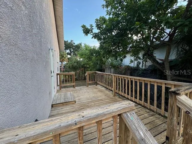 a view of path along with deck and outdoor seating