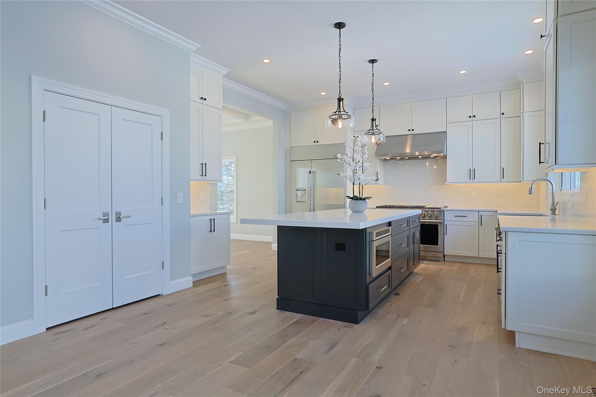41 Croton Dam Road Ossining, NY 10562 - Photo 18 of 30 a large kitchen with stainless steel appliances granite countertop a large counter top a sink a stove and a refrigerator