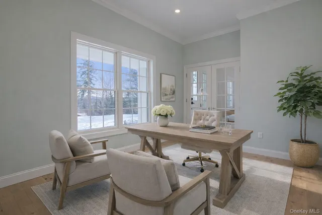 a view of a dining room with furniture and window