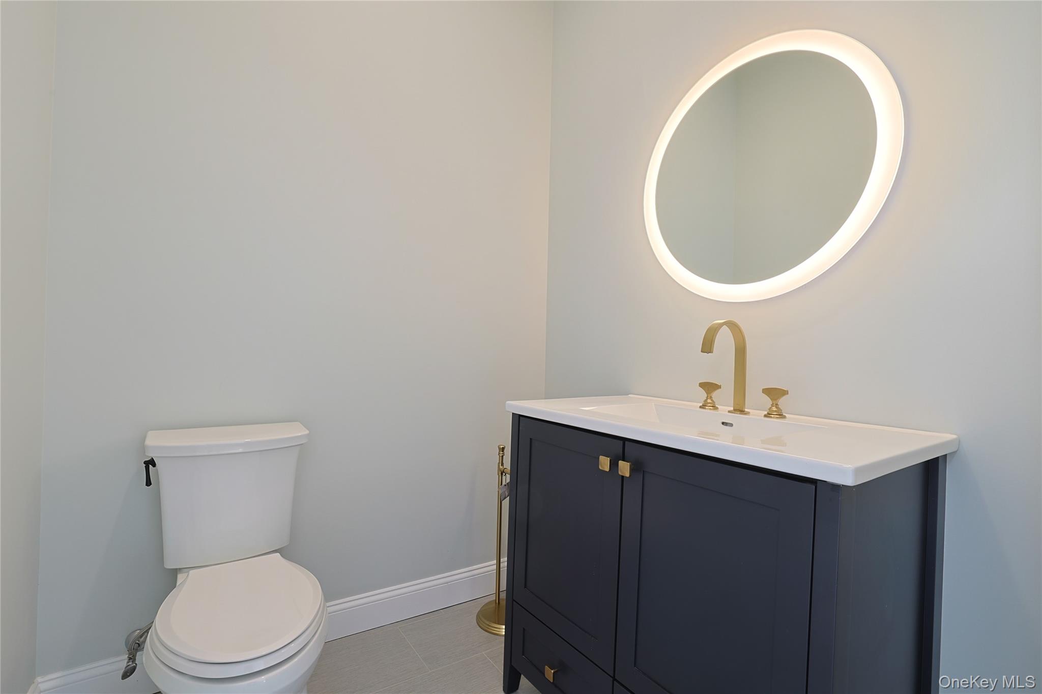 41 Croton Dam Road Ossining, NY 10562 - Photo 21 of 30 a bathroom with a toilet a sink and a mirror
