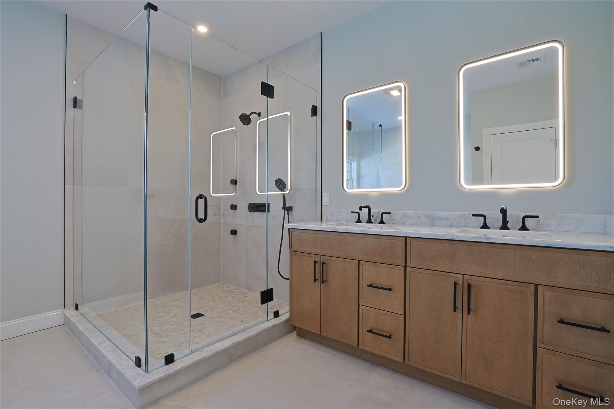 41 Croton Dam Road Ossining, NY 10562 - Photo 23 of 30 a bathroom with a shower sink and mirror
