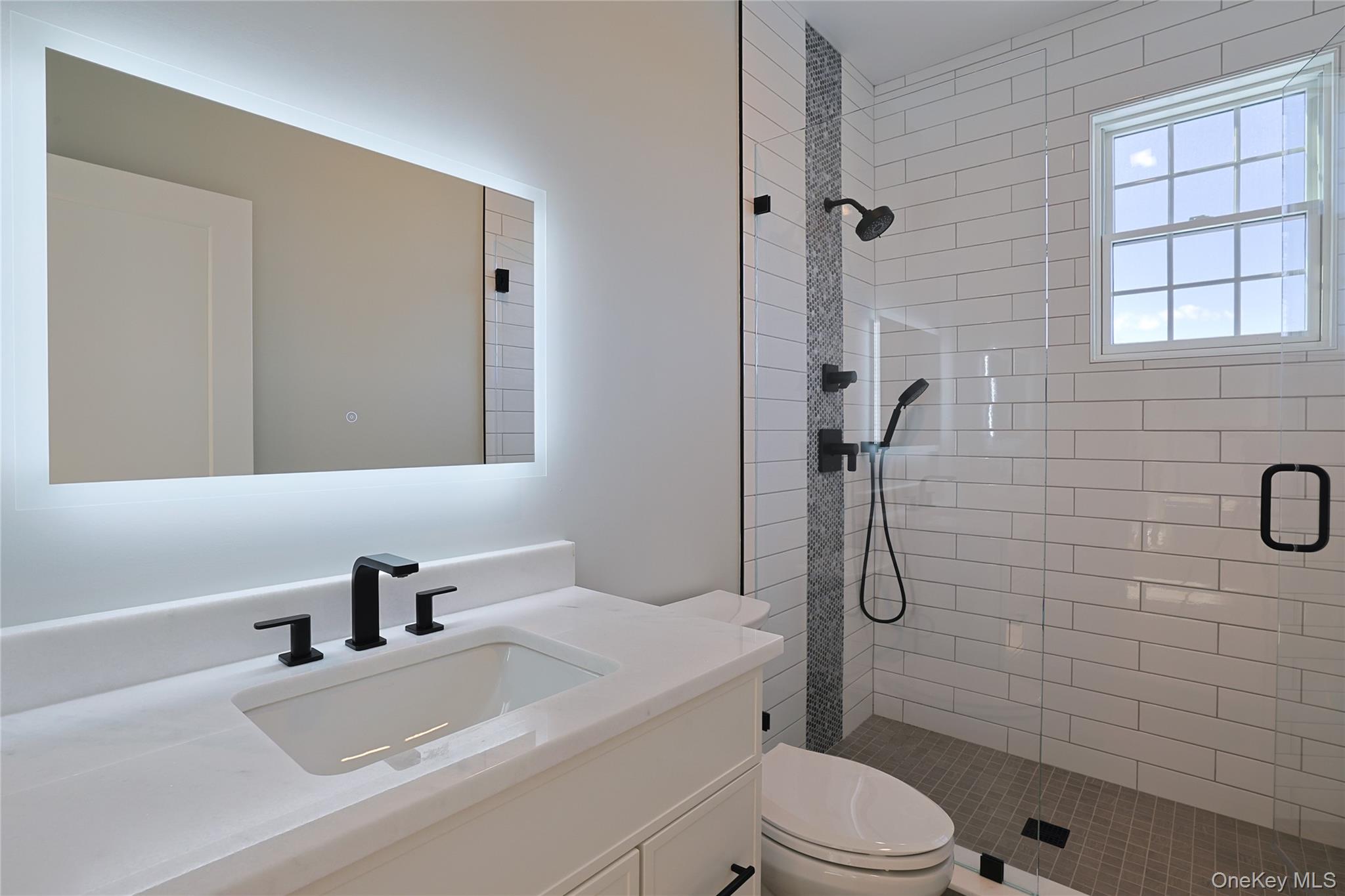 41 Croton Dam Road Ossining, NY 10562 - Photo 27 of 30 a bathroom with a sink toilet and shower