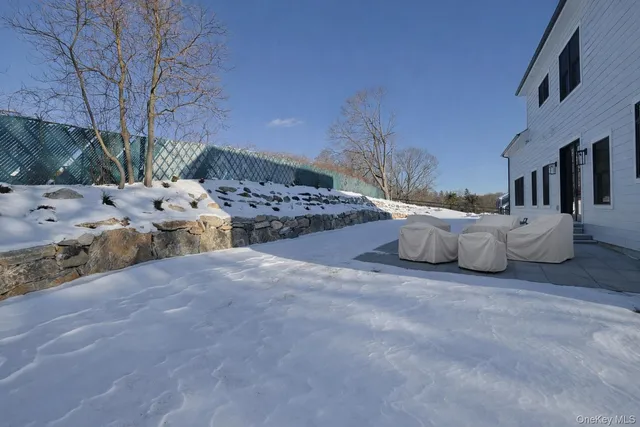 a view of backyard with a table and chairs
