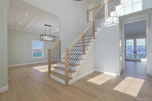 a view of entryway and hall with a front door