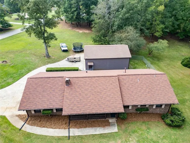 an aerial view of a house having yard