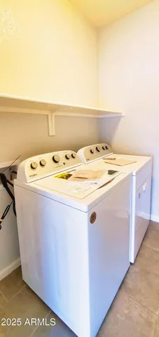 a utility room with washer and dryer