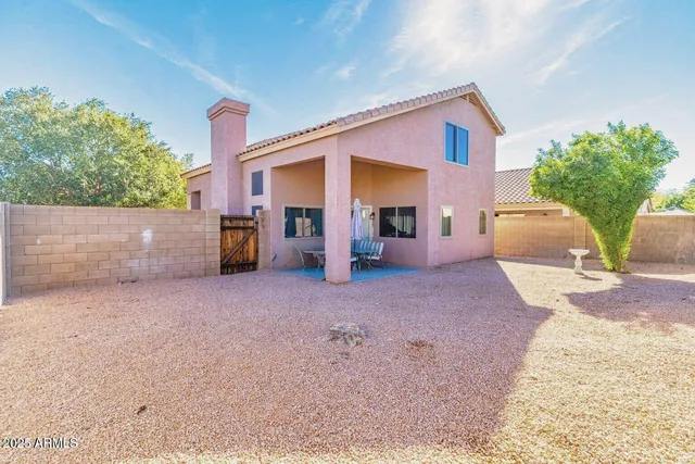 a view of a house with a yard and a garage