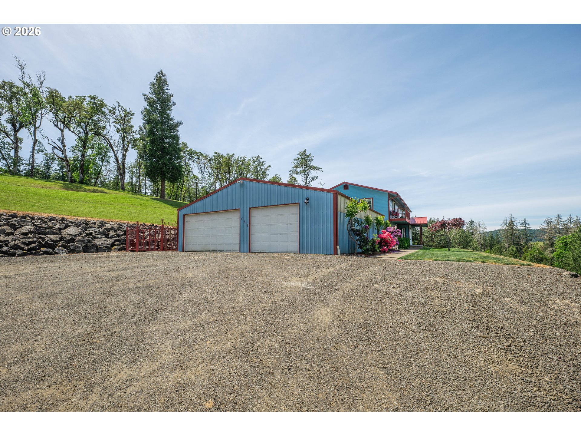 489 Fir Vista Road Sutherlin, OR 97479 - Photo 32 of 47 a big house with a big yard and large trees