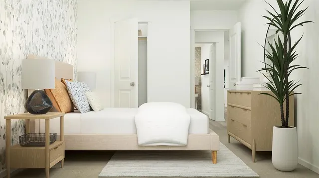 a bedroom with a bed and a couch