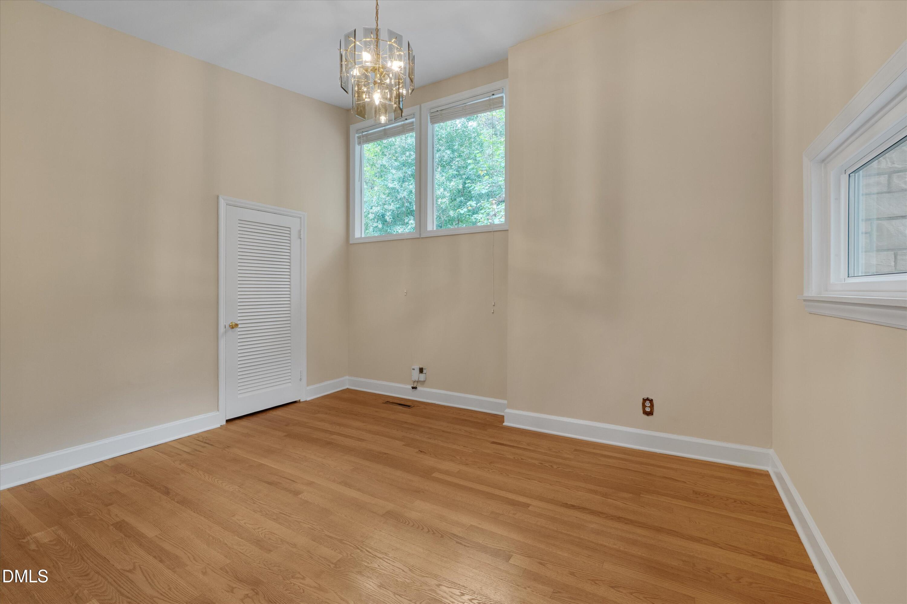 1617 Shawnee Street Durham, NC 27701 - Photo 11 of 56 a view of empty room with wooden floor and fan