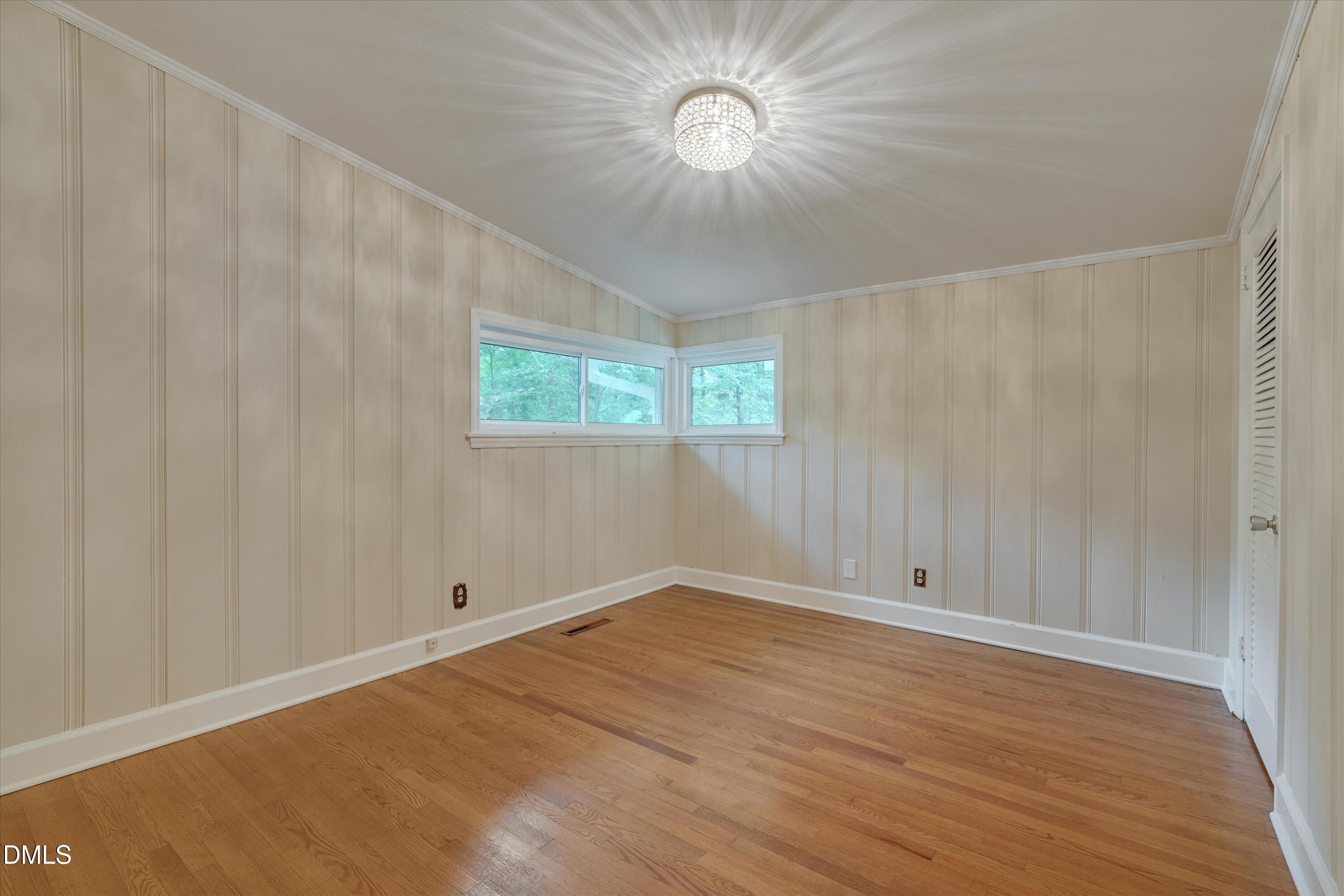 1617 Shawnee Street Durham, NC 27701 - Photo 14 of 56 an empty room with windows and fan