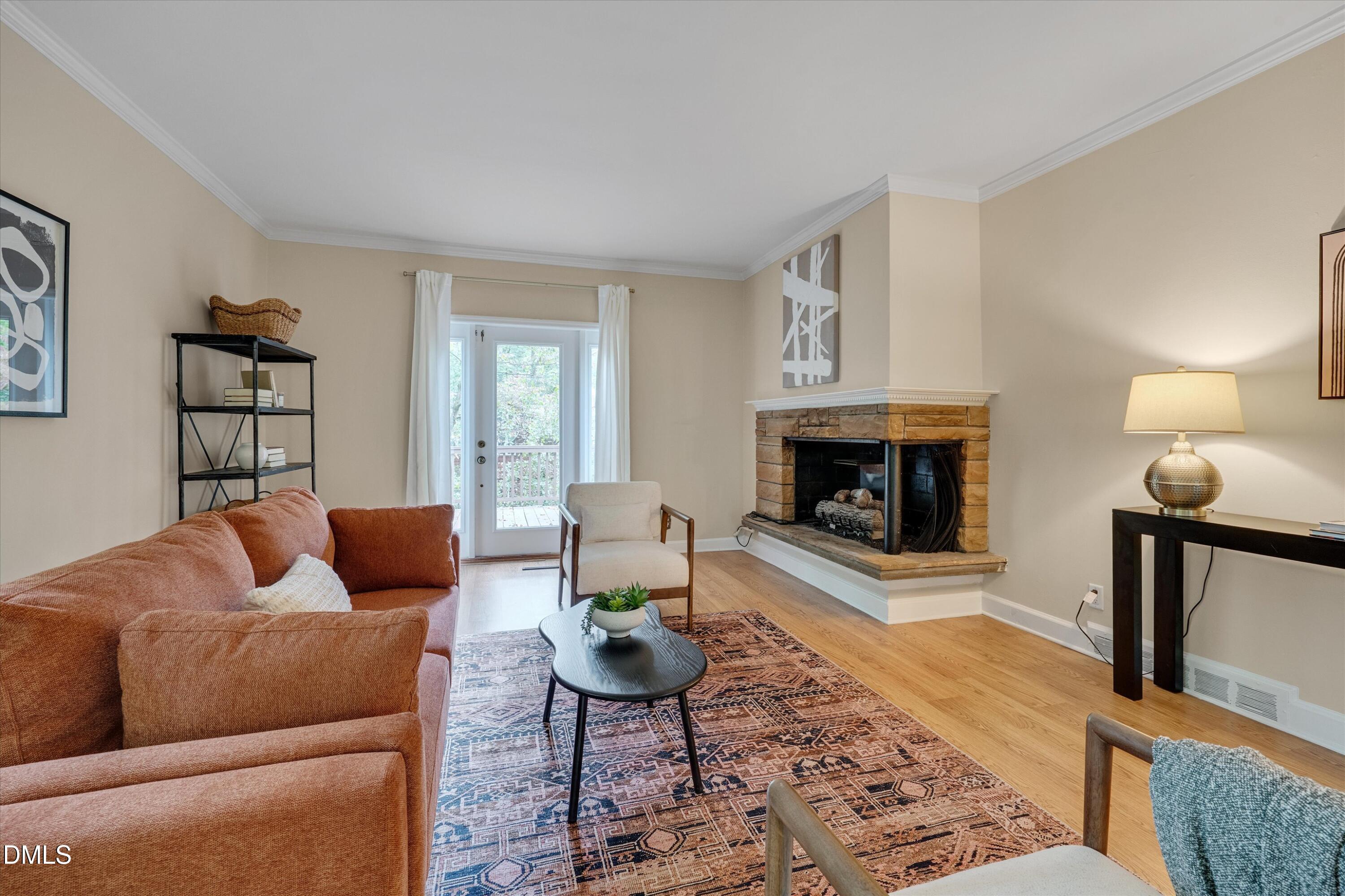 1617 Shawnee Street Durham, NC 27701 - Photo 18 of 56 a living room with furniture and a fireplace