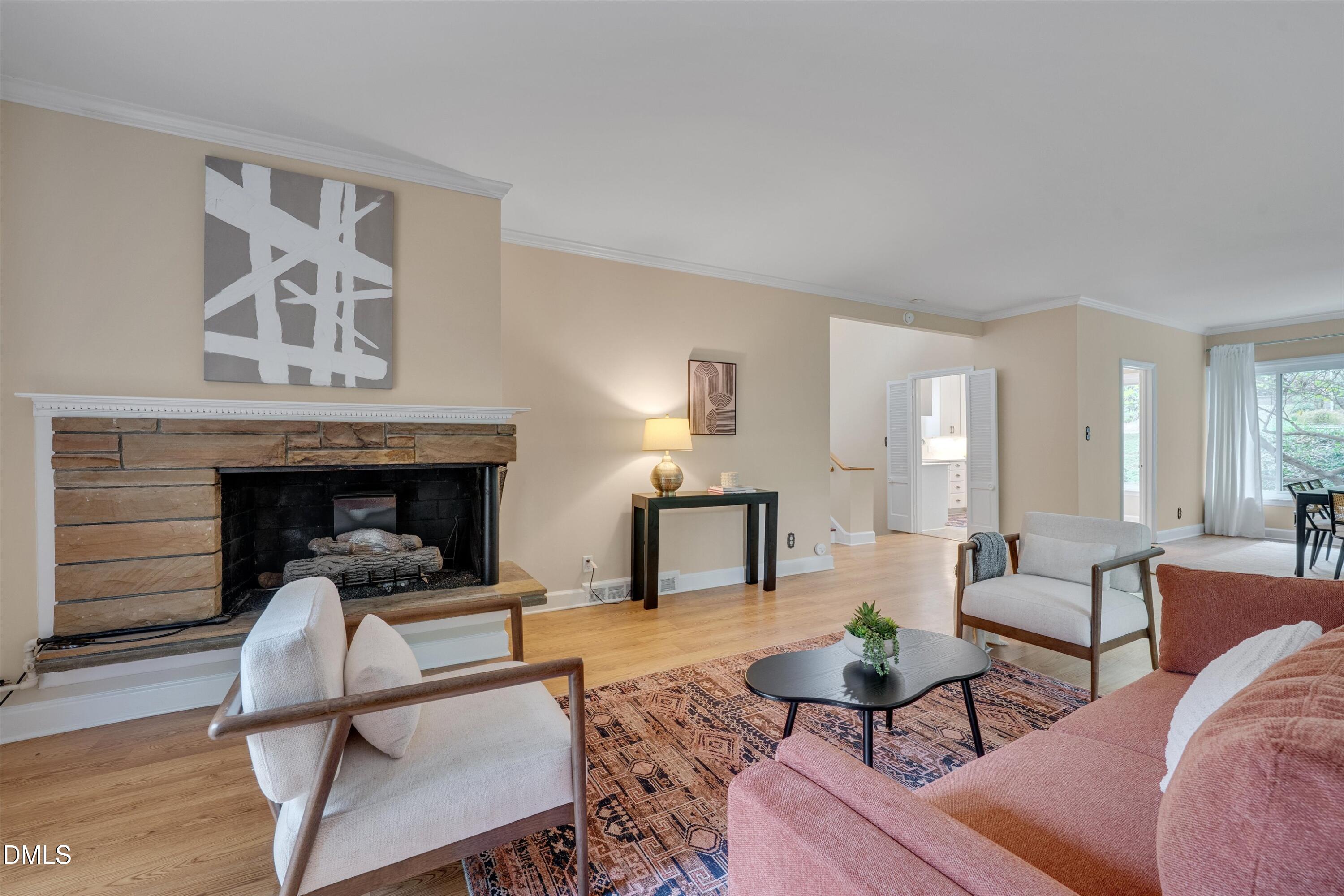 1617 Shawnee Street Durham, NC 27701 - Photo 22 of 56 a living room with furniture and a fireplace