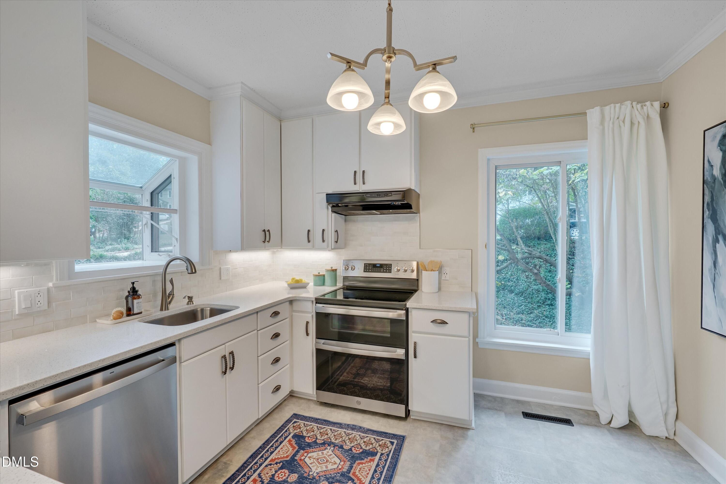 1617 Shawnee Street Durham, NC 27701 - Photo 27 of 56 a kitchen with a stove and a sink