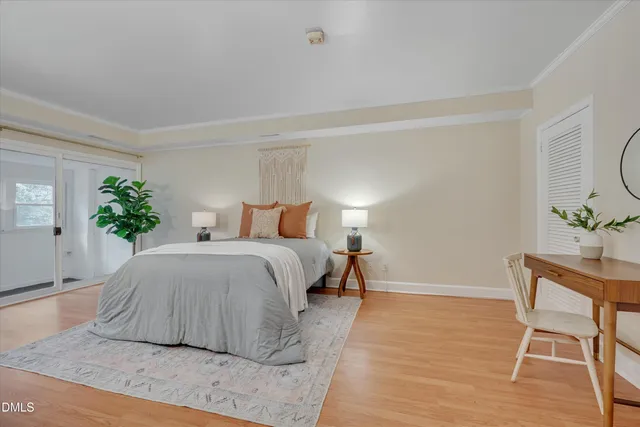 a bedroom with a bed and a table