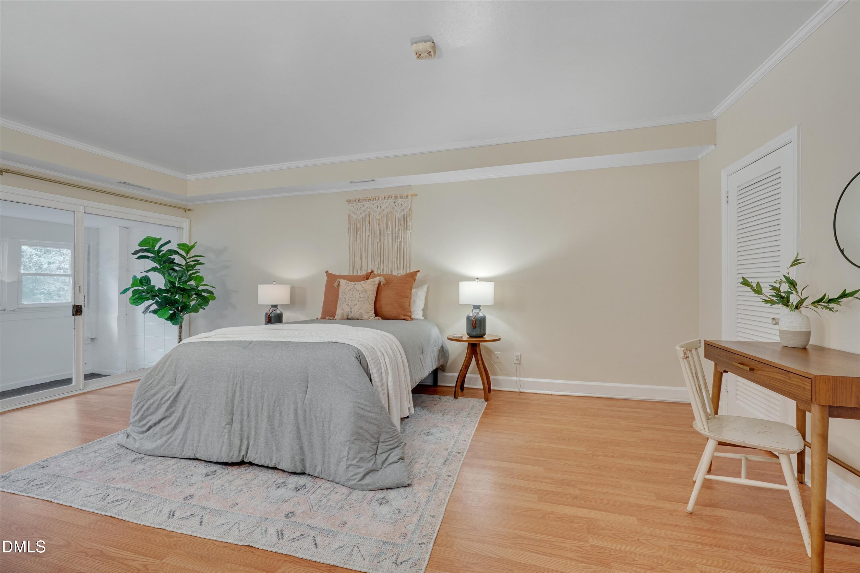 1617 Shawnee Street Durham, NC 27701 - Photo 30 of 56 a bedroom with a bed and a table