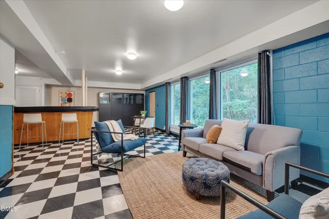 a kitchen with stainless steel appliances granite countertop a sink and a refrigerator