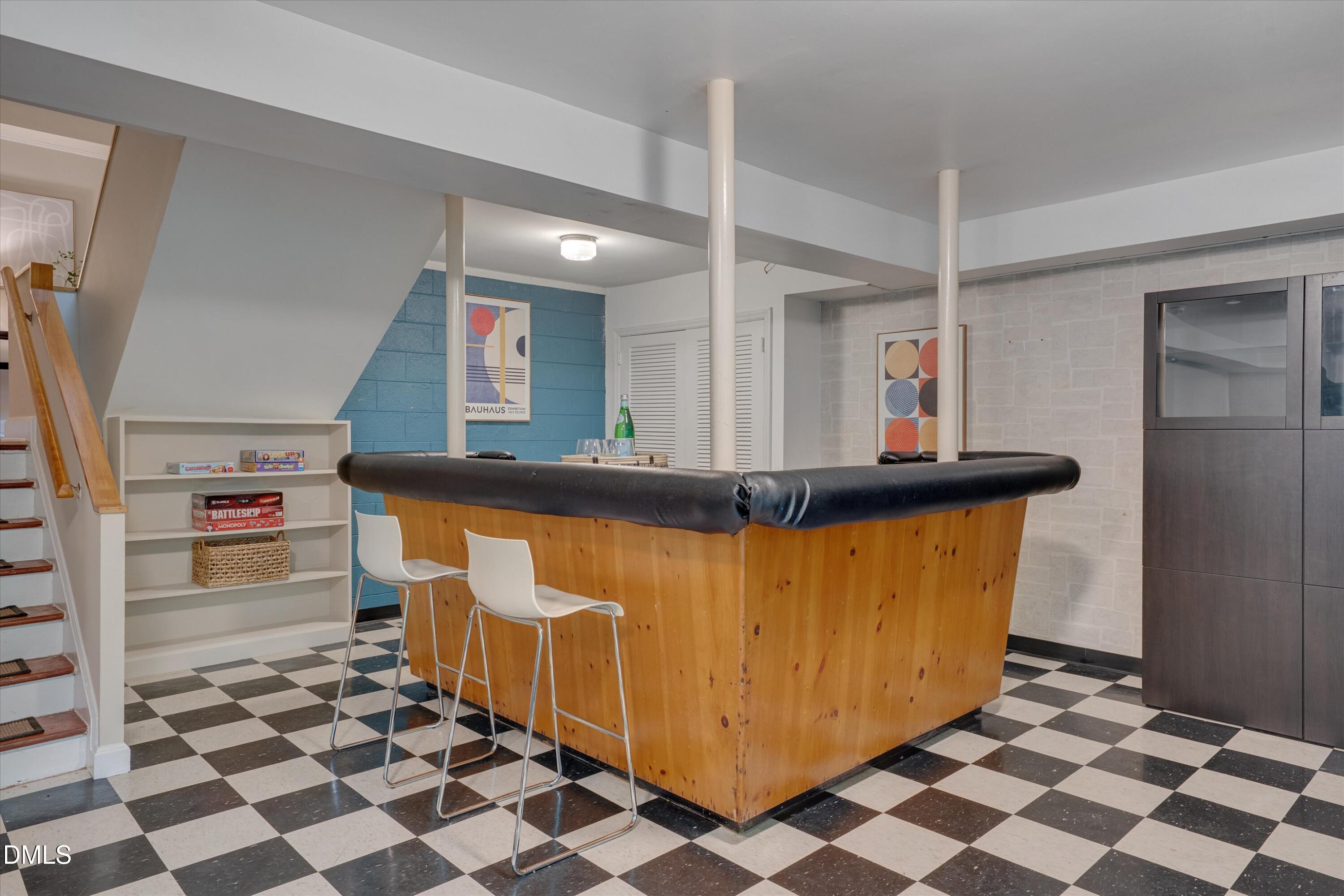 1617 Shawnee Street Durham, NC 27701 - Photo 42 of 56 a kitchen with stainless steel appliances granite countertop a sink and a refrigerator