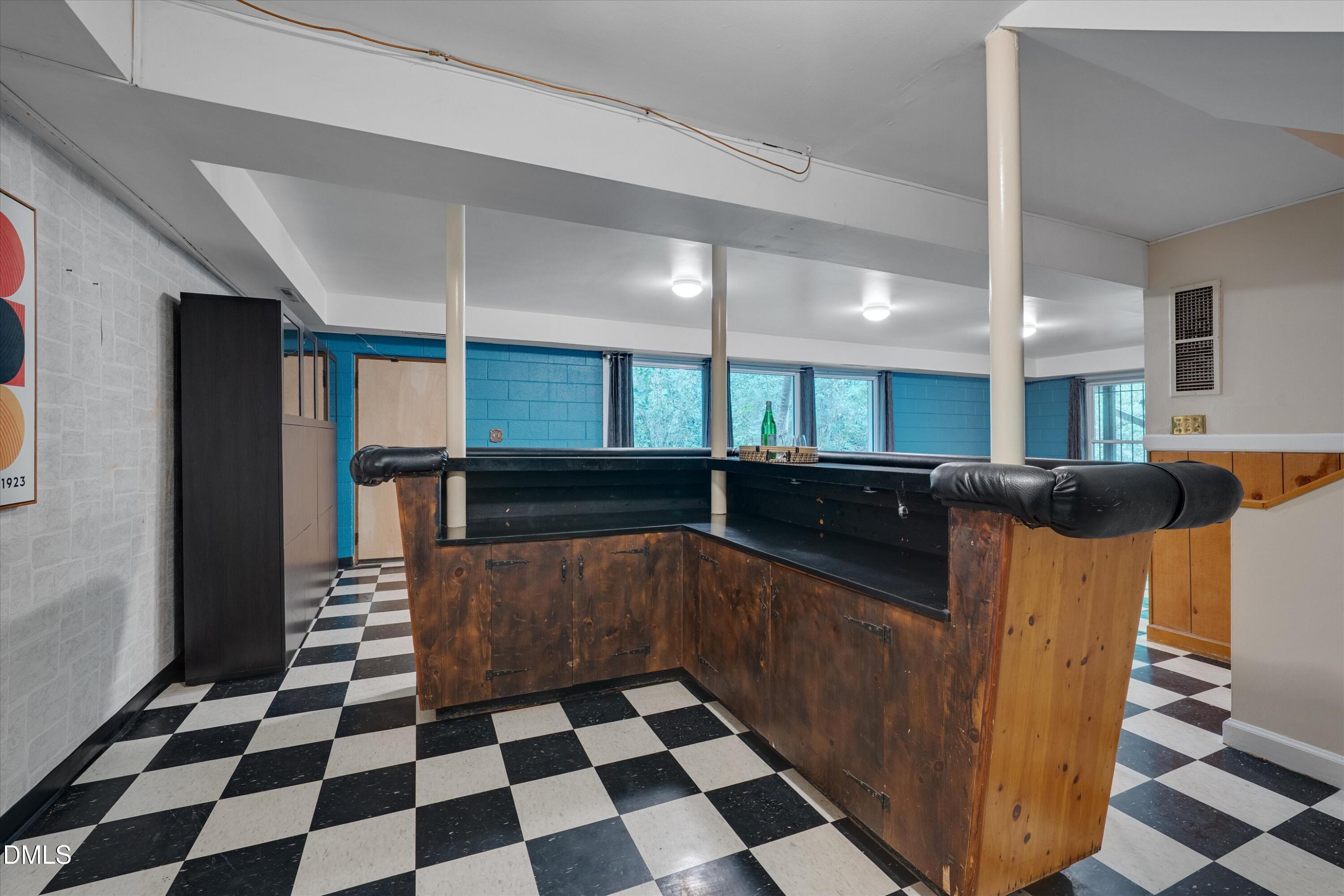 1617 Shawnee Street Durham, NC 27701 - Photo 43 of 56 a kitchen with stainless steel appliances granite countertop a sink and a cabinets
