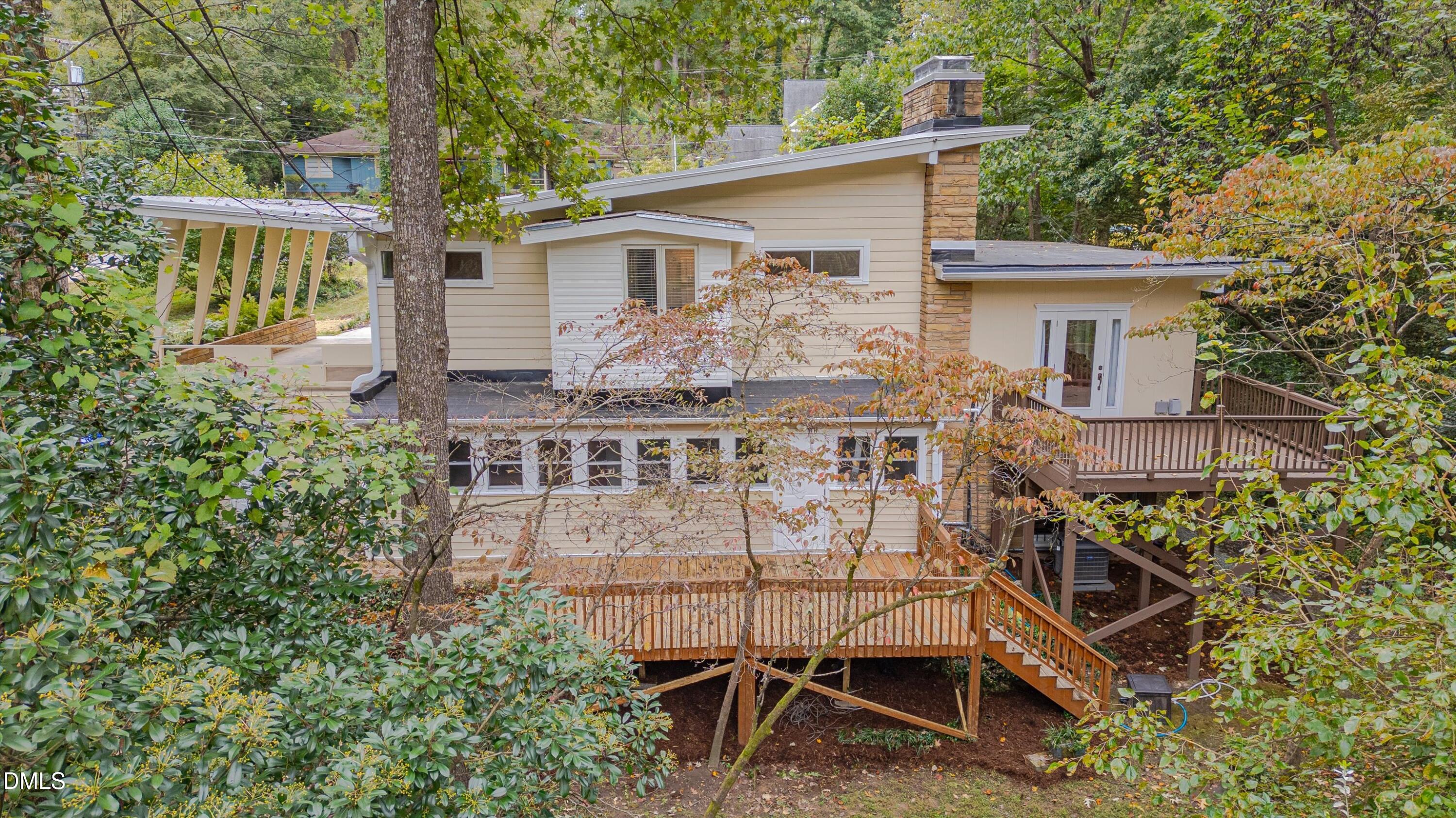 1617 Shawnee Street Durham, NC 27701 - Photo 46 of 56 a view of a house with a chairs and table in a patio