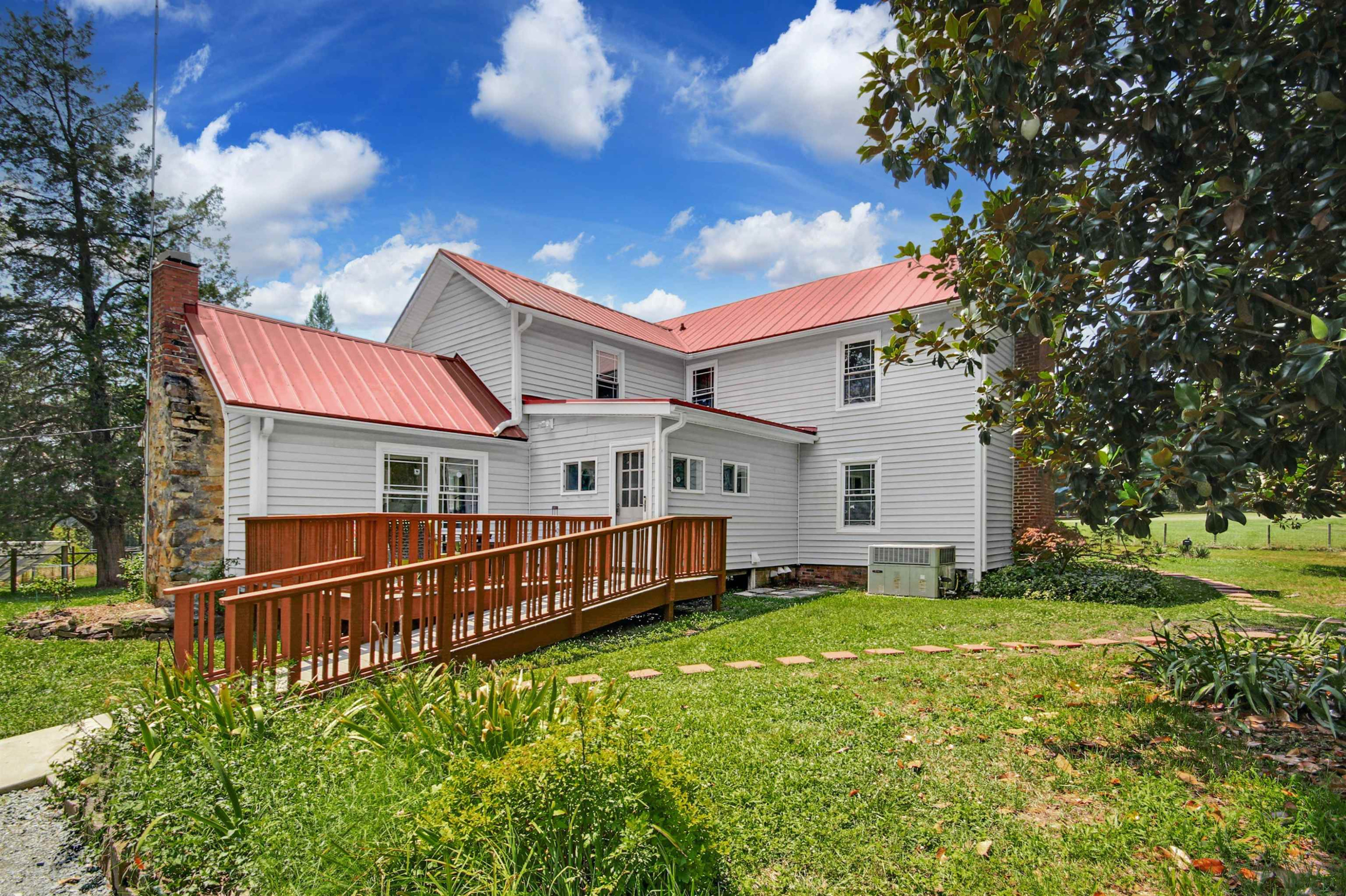 4610 Hall Road Rougemont, NC 27503 - Photo 35 of 44 a front view of house with yard and trees in the background