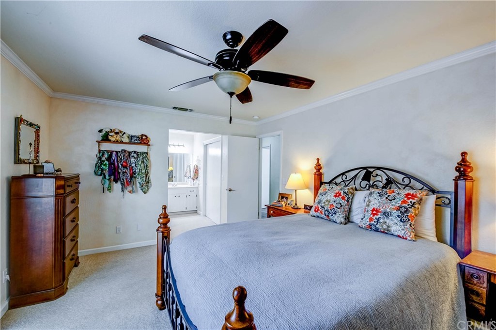 7 Forest Creek Circle Chico, CA 95928 - Photo 11 of 17 a bed room with a bed and a chandelier