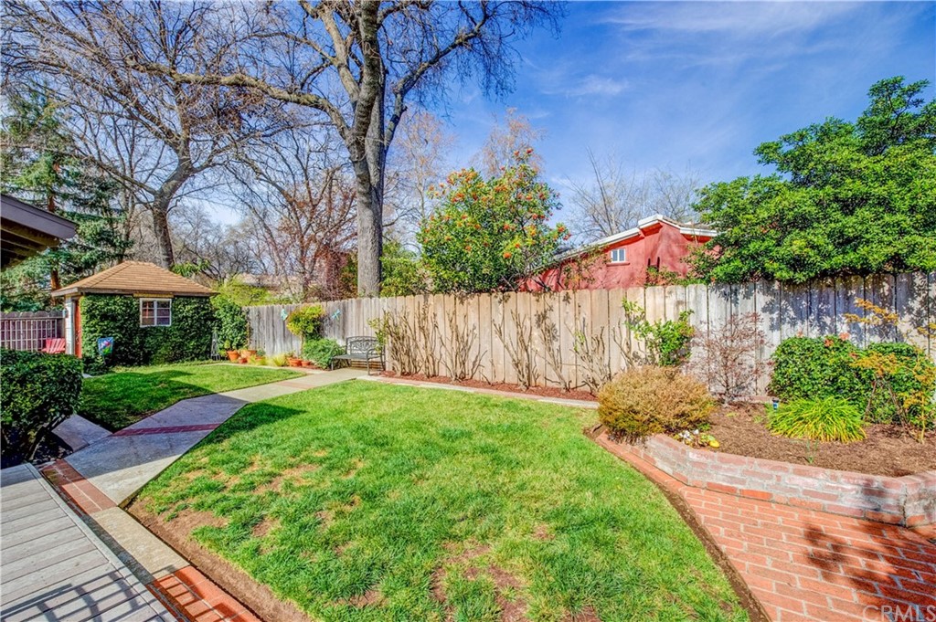 7 Forest Creek Circle Chico, CA 95928 - Photo 16 of 17 a backyard of a house with lots of green space