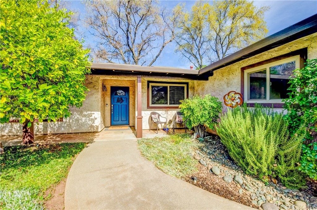 7 Forest Creek Circle Chico, CA 95928 - Photo 2 of 17 a front view of a house with garden