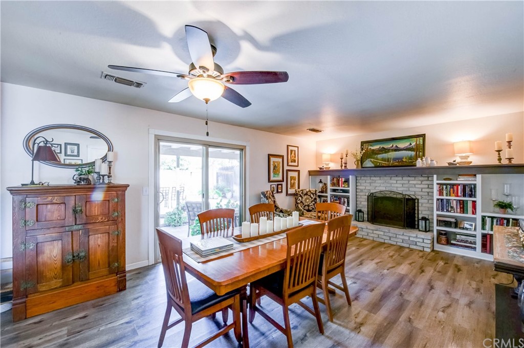 7 Forest Creek Circle Chico, CA 95928 - Photo 6 of 17 a dining room with furniture window fireplace and wooden floor