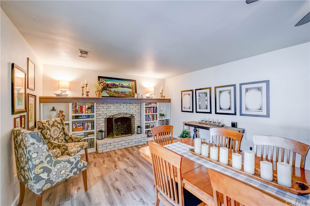 7 Forest Creek Circle Chico, CA 95928 - Photo 7 of 17 a living room with furniture a fireplace and a wooden floor