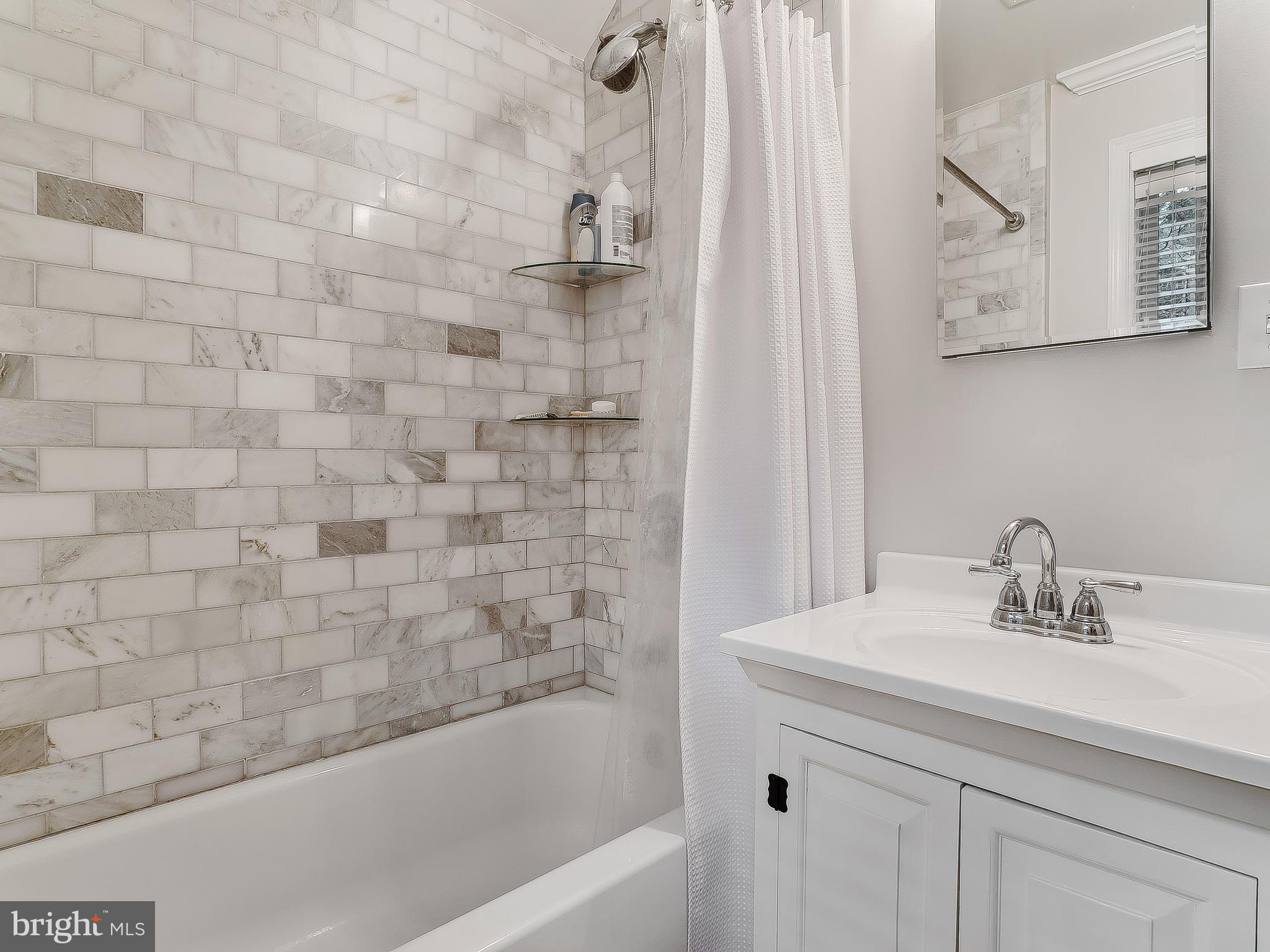 10205 Carson Place Silver Spring, MD 20901 - Photo 19 of 30 a bathroom with a sink and a bathtub