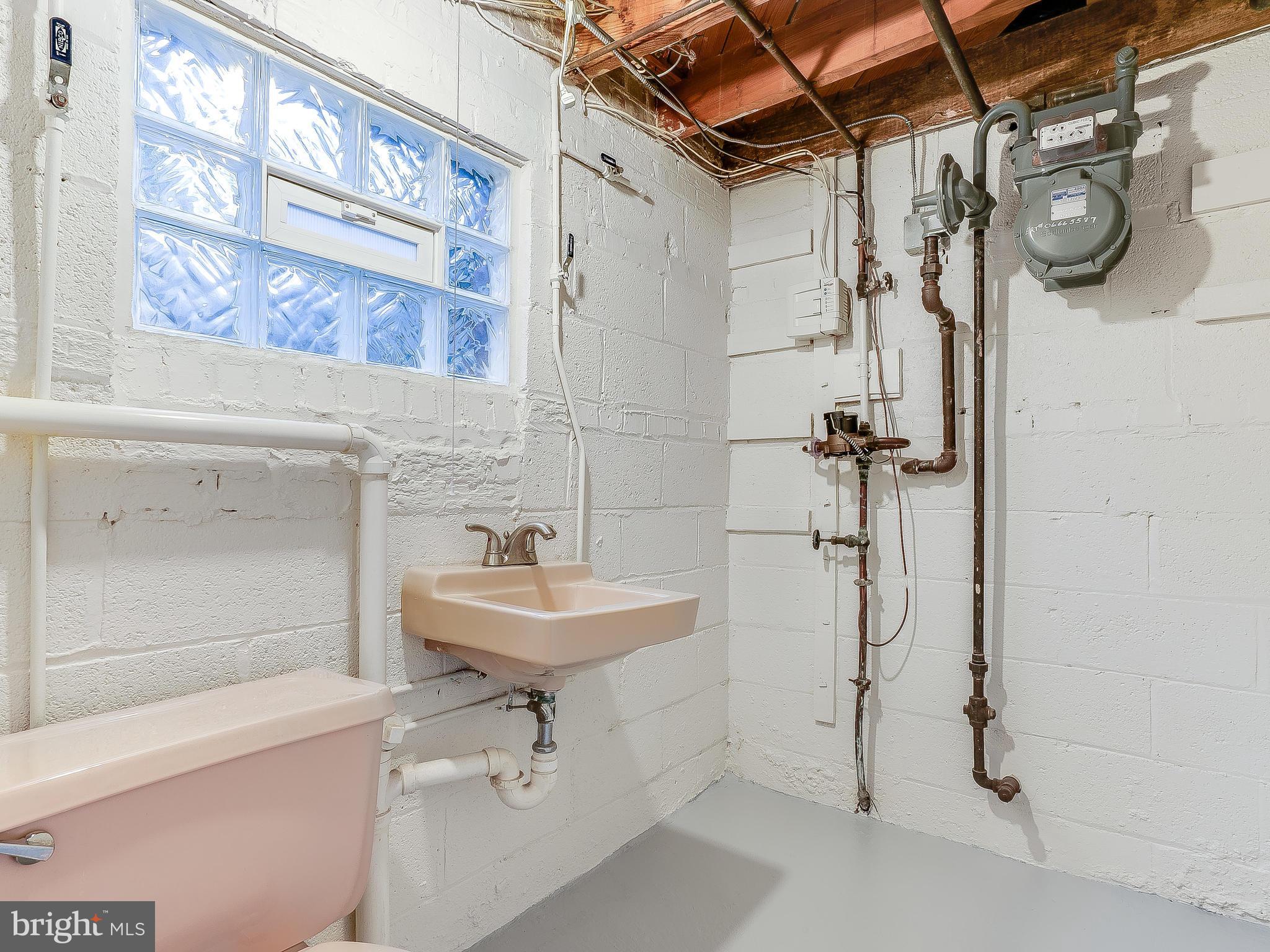 10205 Carson Place Silver Spring, MD 20901 - Photo 21 of 30 a bathroom with a sink a toilet and shower