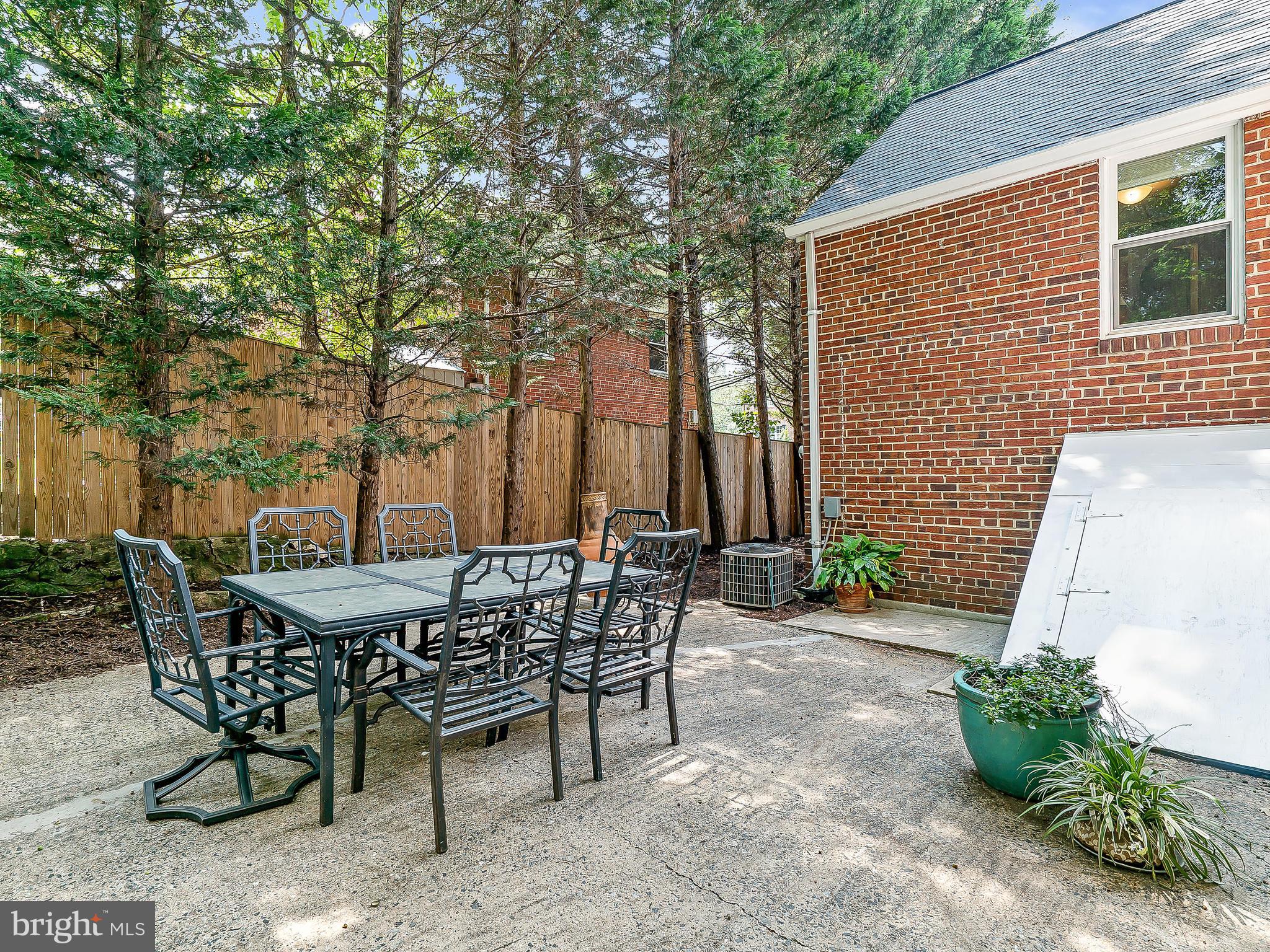 10205 Carson Place Silver Spring, MD 20901 - Photo 24 of 30 a patio with table and chairs and potted plants