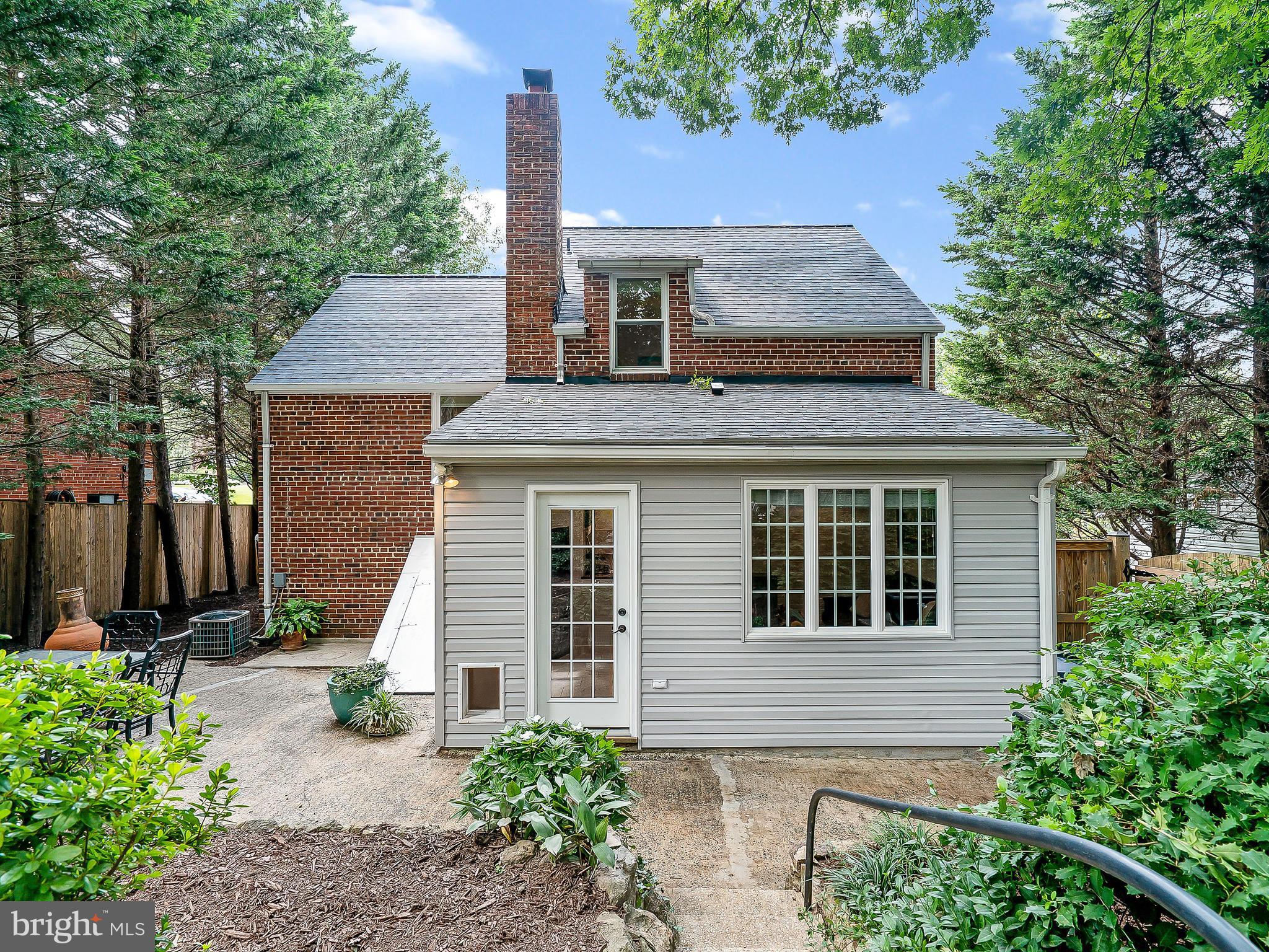 10205 Carson Place Silver Spring, MD 20901 - Photo 25 of 30 a front view of a house with a garden