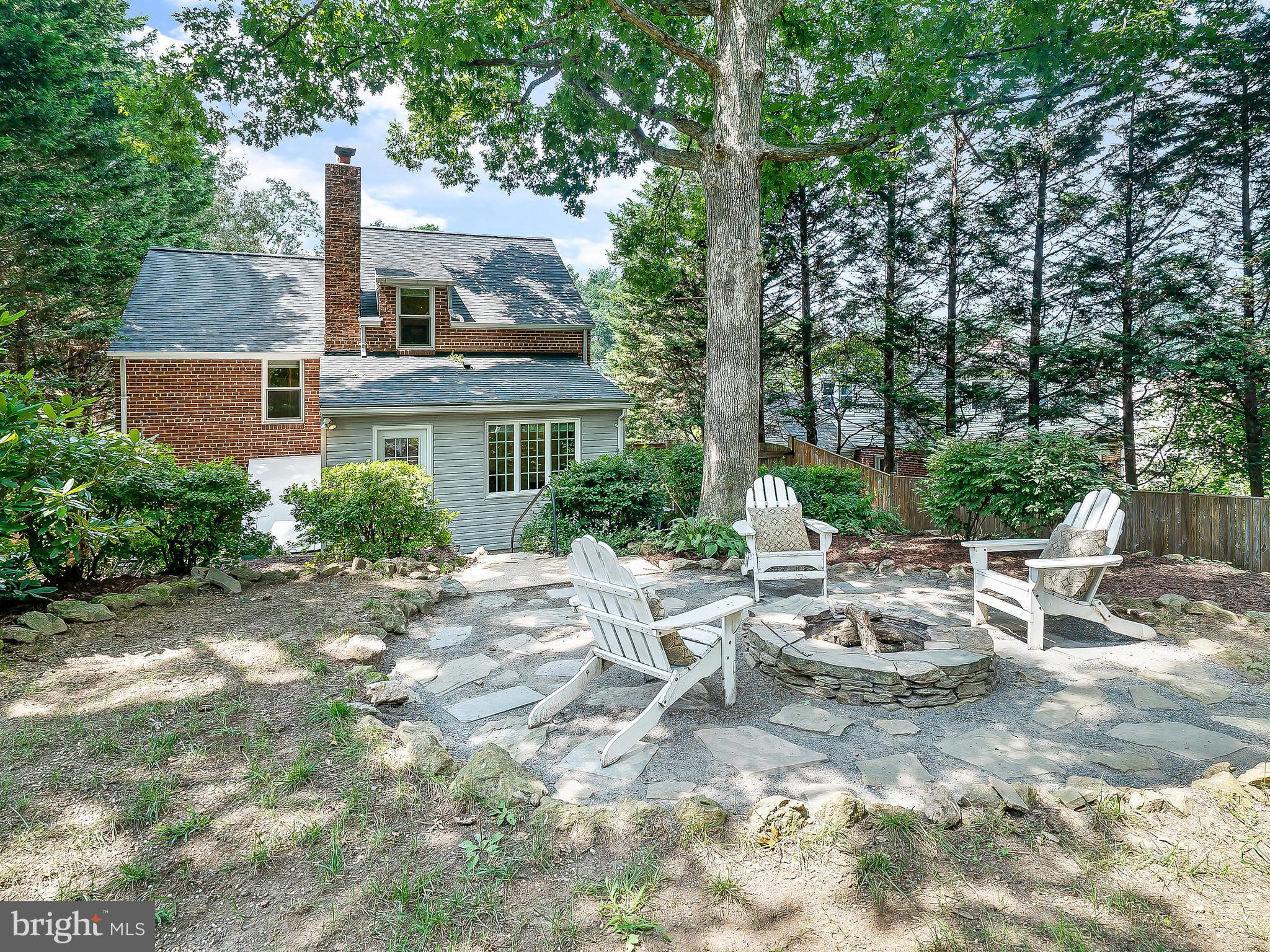 10205 Carson Place Silver Spring, MD 20901 - Photo 27 of 30 a view of a chair and table in backyard