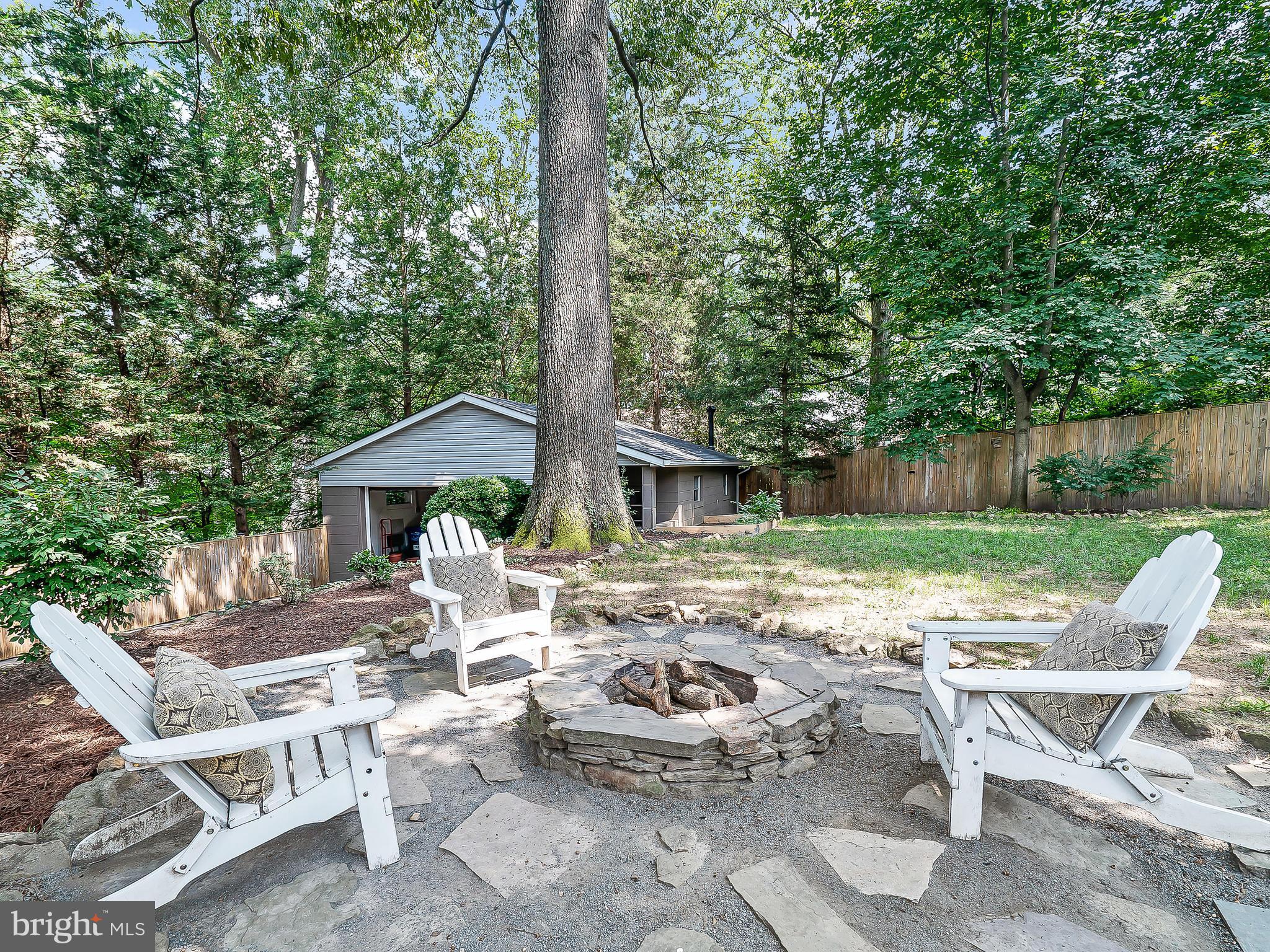 10205 Carson Place Silver Spring, MD 20901 - Photo 28 of 30 a view of a chairs and table in backyard of the house