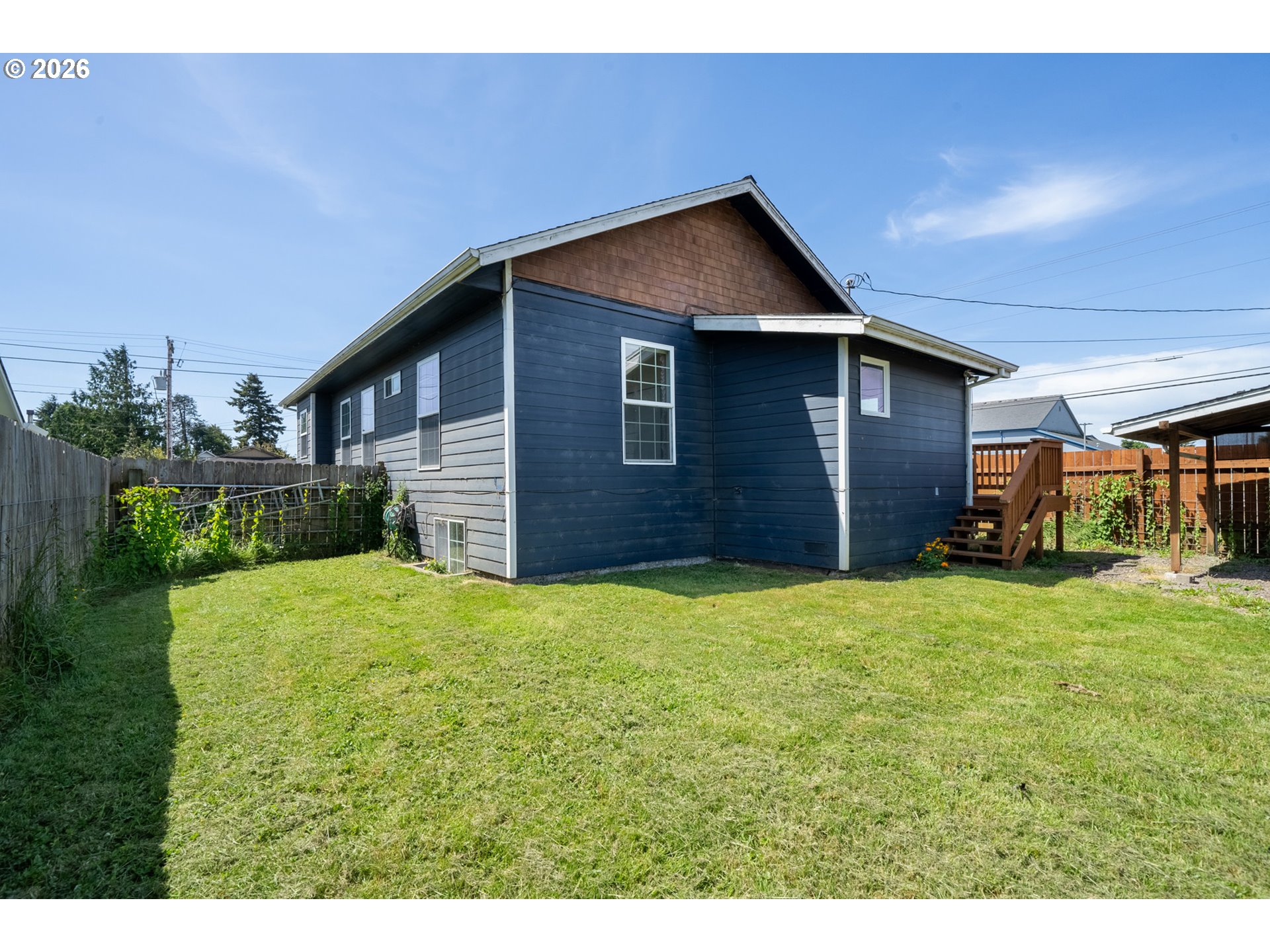 1802 8th Street Tillamook, OR 97141 - Photo 36 of 37 a brick house with a yard and garage